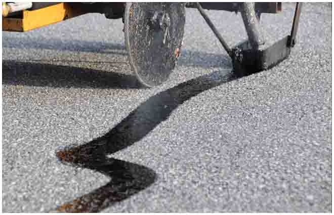 Hot asphalt crack repair on an existing pavement surface